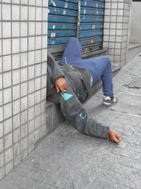 High angle view of man lying on floor