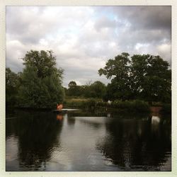 Scenic view of lake against cloudy sky