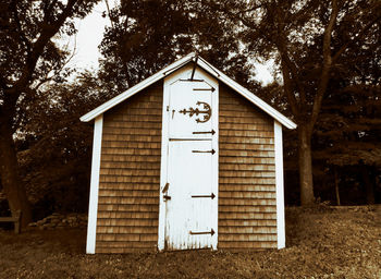 Exterior of house amidst trees and plants in forest