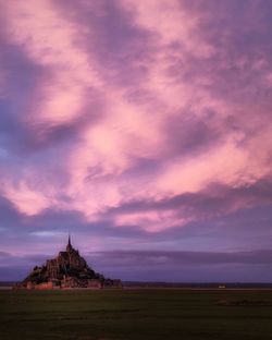 Scenic view of sea against sky during sunset in le mont st. michel