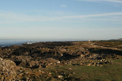 Scenic view of sea and rocks against sky