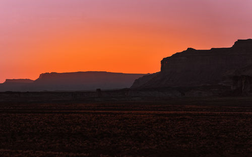 Scenic view of silhouette landscape against sky during sunset