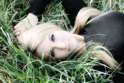 Close-up portrait of young woman relaxing outdoors