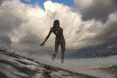 Female surfer on a wave