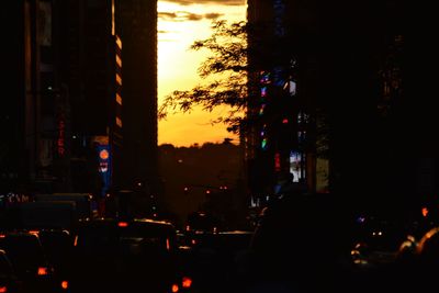 Cars on illuminated city at night