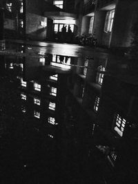 View of illuminated buildings in city at night