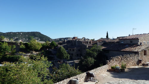 Panoramic view of old building against clear blue sky