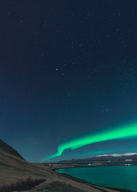 High angle view of illuminated bridge against sky at night