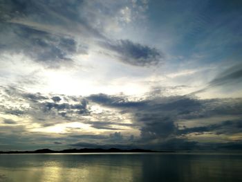 Scenic view of lake against dramatic sky