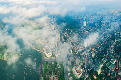 High angle view of illuminated street amidst buildings in city