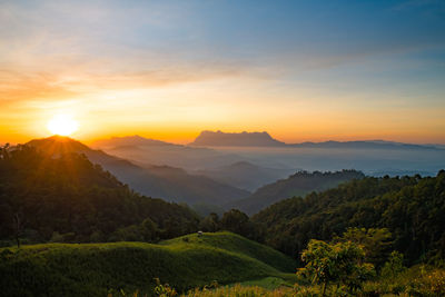 Scenic view of mountains against sky during sunset