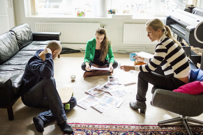 Business people conversing in creative office