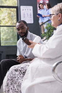 Doctor examining patient in hospital