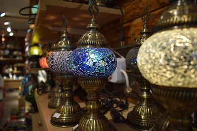 Close-up of illuminated lamp hanging in store