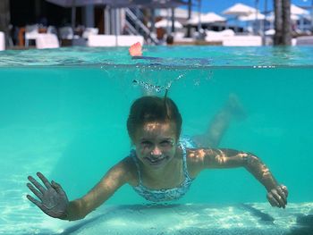 Portrait of girl swimming in pool