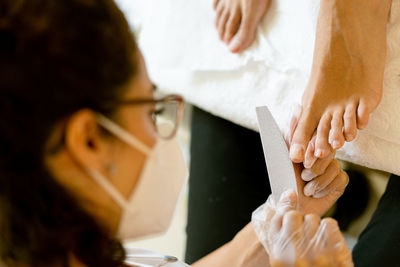 Midsection of couple holding hands