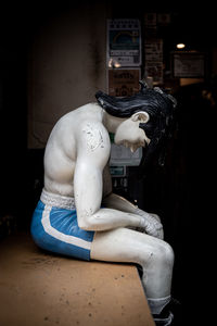 Statue of man sitting at home