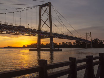 View of suspension bridge at sunset