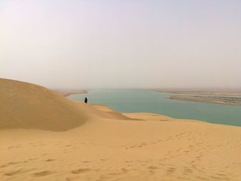 Scenic view of beach against clear sky