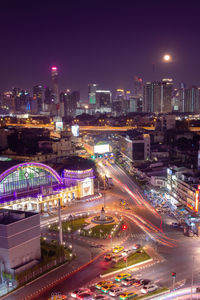 High angle view of illuminated buildings in city at night