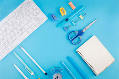 School supplies on blue background. back to school. banner.