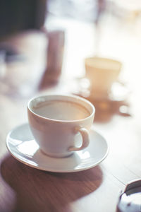 Close-up of coffee cup on table