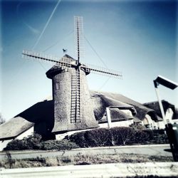 Traditional windmill against sky