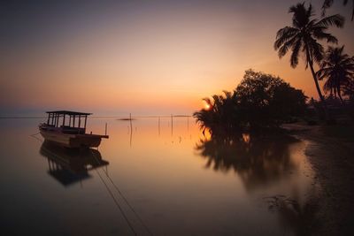 Scenic view of sea against sky at sunset