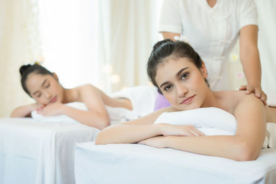 Young woman receiving massage in spa