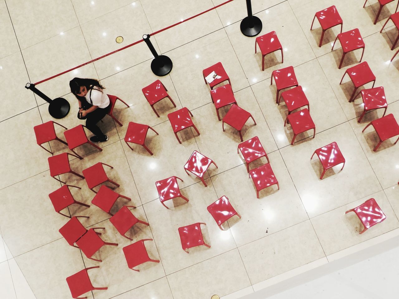 high angle view, indoors, art and craft, red, still life, art, creativity, pattern, no people, geometric shape, close-up, wall - building feature, human representation, built structure, circle, multi colored, directly above, shape, day, architecture