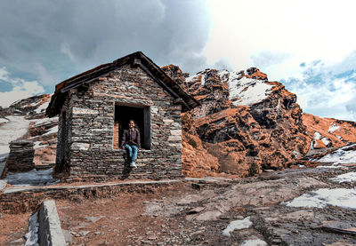 House on a mountain against sky