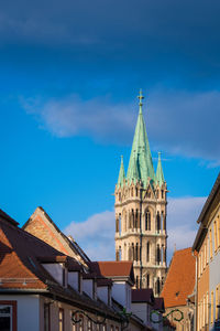 Low angle view of buildings against blue sky