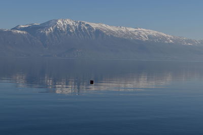 Scenic view of ohrid lake and mountains against sky in winter time