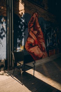 Midsection of man on table by sidewalk