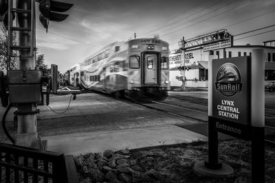 Train on street against sky