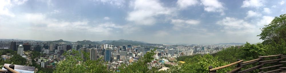 Scenic view of mountains against cloudy sky