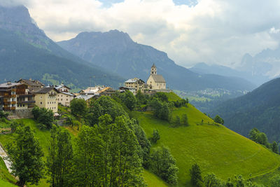 Panoramic view of trees and buildings against sky