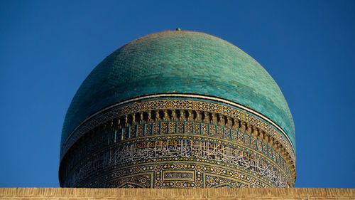 Low angle view of a building against blue sky