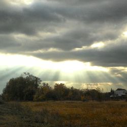 Scenic view of landscape against cloudy sky