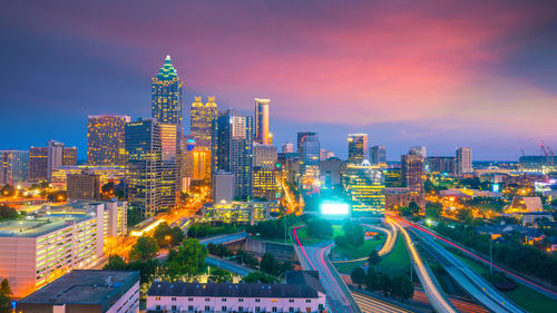 High angle view of illuminated buildings in city against sky