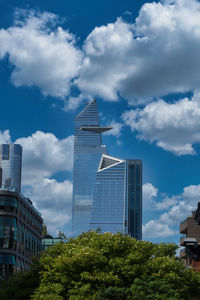 Low angle view of modern buildings against sky