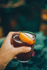 Close-up of hand holding drink
