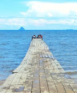 Scenic view of sea against cloudy sky