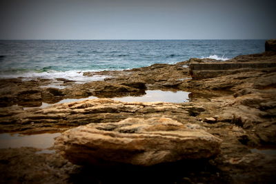 View of rock formations at seaside