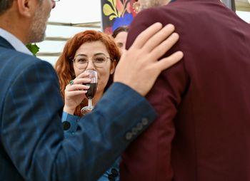 Portrait of a smiling woman drinking in a party