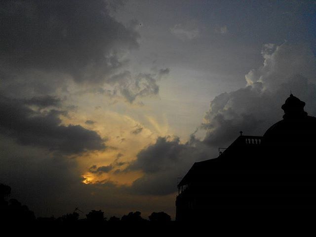 silhouette, building exterior, architecture, built structure, sunset, sky, cloud - sky, cloud, cloudy, dusk, low angle view, house, beauty in nature, outdoors, nature, scenics, building, no people, place of worship, dark