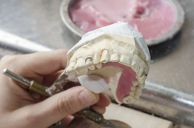 Close-up of hand holding ice cream