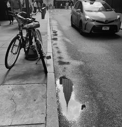 Bicycle parked on street in city