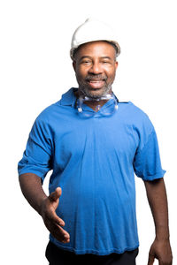 Portrait of smiling man standing against white background
