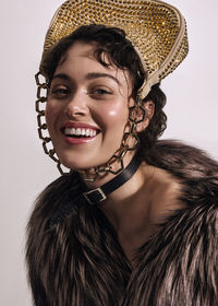 Portrait of young woman wearing hat